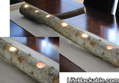 Image: a length of tree trunk with holes bored in it for tea lights.